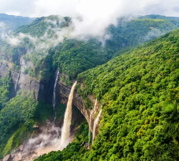 Cherrapunji waterfall in lush green hills during monsoon – top place to visit in monsoon in India 