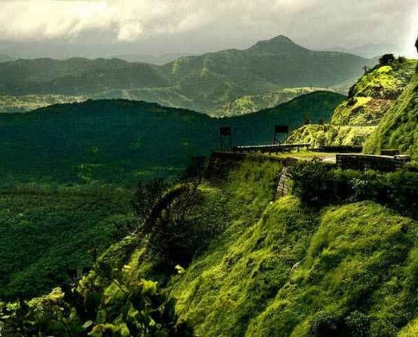 Green mountain cliffs and foggy atmosphere in Lonavala, Maharashtra, during the rainy season.